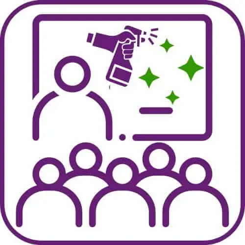 Trainer teaching, spray bottle on board – symbol of team supervision.